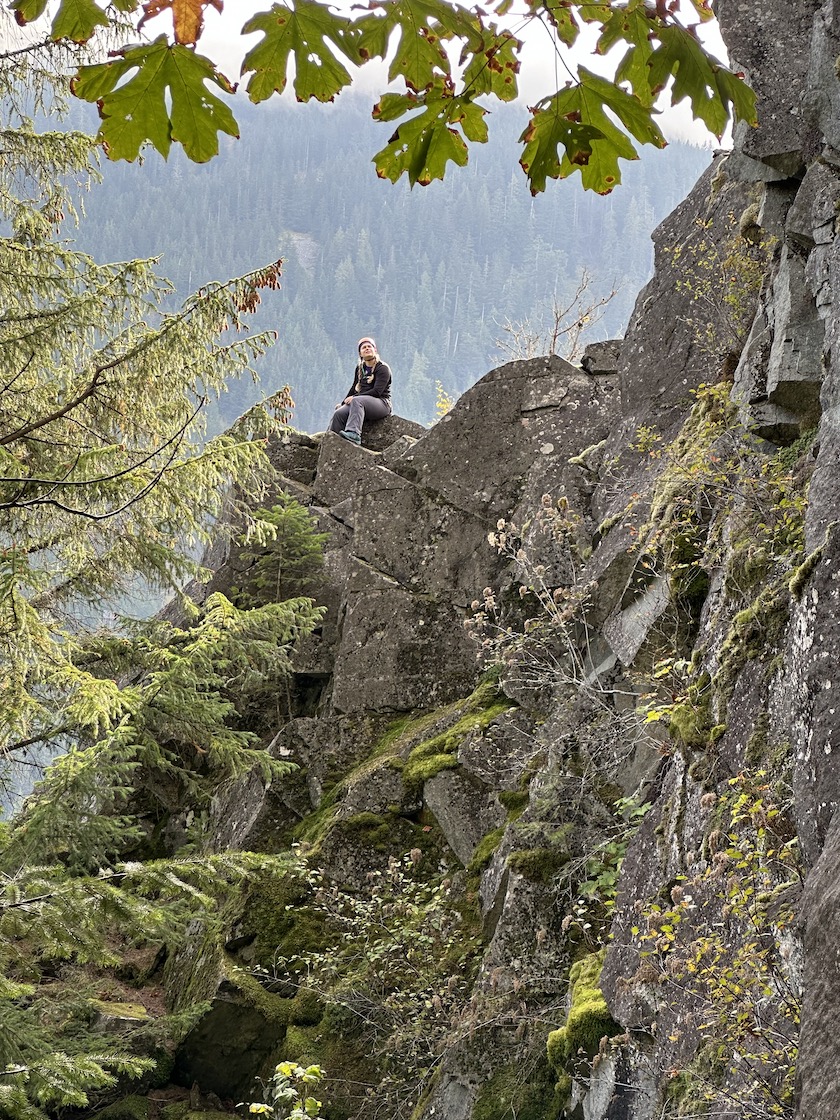 Julia on peak in Shangri-La climbing area.
